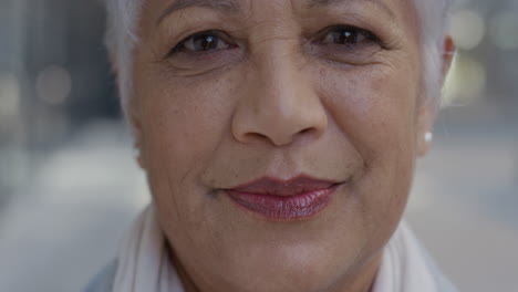 close-up-portrait-senior-indian-business-woman-smiling-enjoying-successful-lifestyle-stylish-mature-female-in-city-slow-motion-aging-beauty