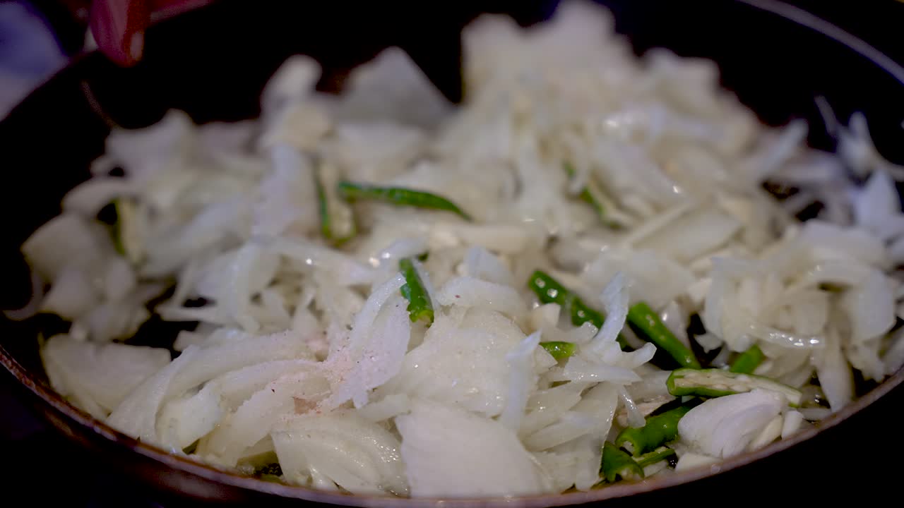 Stirring Fresh Sliced White Onions In Saucepan With