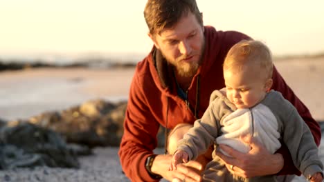 father and baby boy playing with their dog 4k