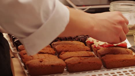 artezan bread with red strawberry jam on top, fresh bake double chocolate banana artesian bread in bakery shop close-up. artisan bread is making by skill bakers using natural and high-quality ingredients. food with health and flavour benefits. sweet breads for dessert and breakfast
