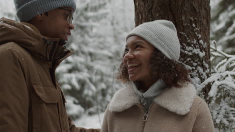 couple enjoying a winter day in the forest