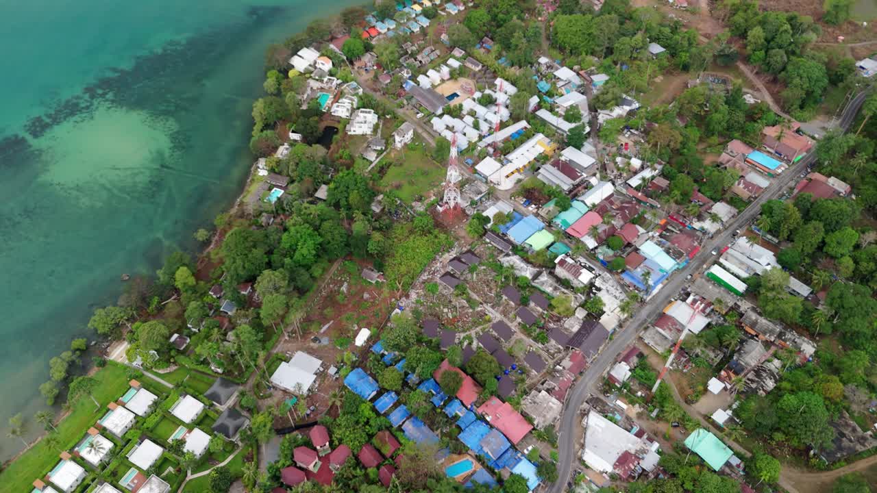 A birds-eye view of Lonely Beach on Koh Chang, Thailand showing the village, shops, main road and guest house accommodation