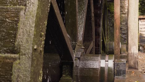 Close-up-on-two-hydraulic-wheels-from-a-water-mill