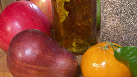 beauty shot, herb infused olive oil placed in between fruit