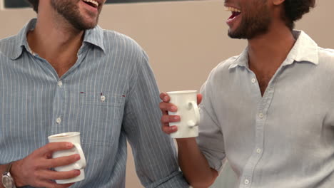 gay couple drinking cup of coffee