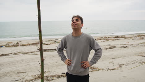 tired guy after working on the beach near the ocean