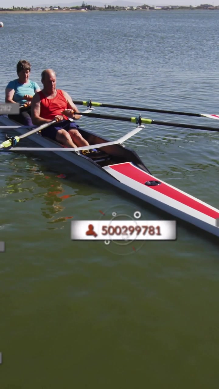 Vertical video: Man and woman rowing oars splashing making wake as cursor clicking sports overlays