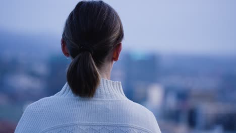 young woman overlooking oslo, norway.