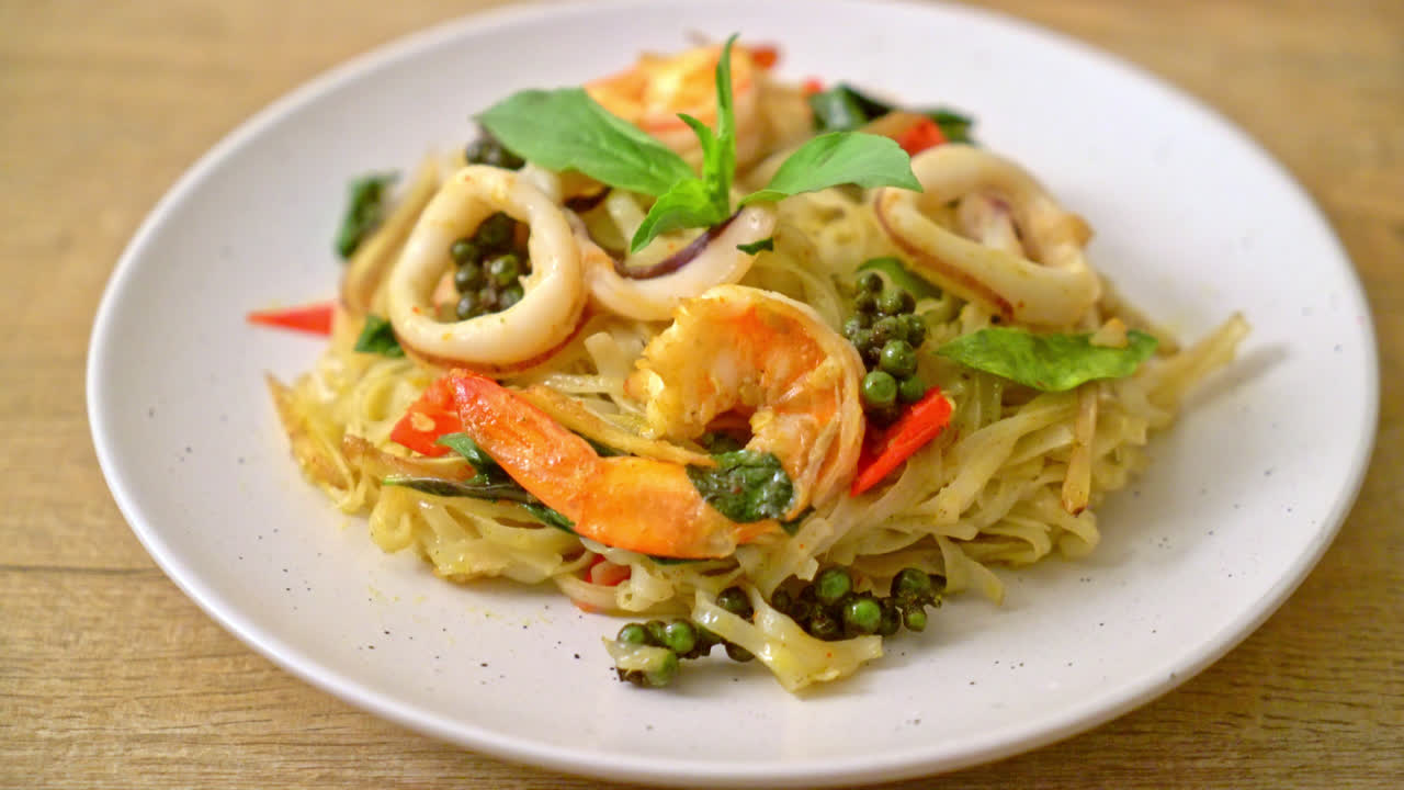 stir fried spicy noodles with sea food (Pad Cha Talay) - Thai food style