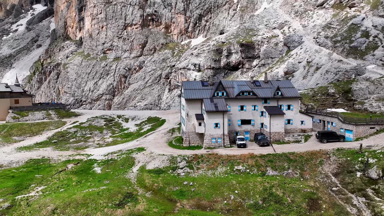 Aerial view above Val di Tires, with the Catinaccio - Torri del Vajolet Rosengarten in the background, South Tyrol, Italy