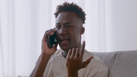 young man arguing on phone