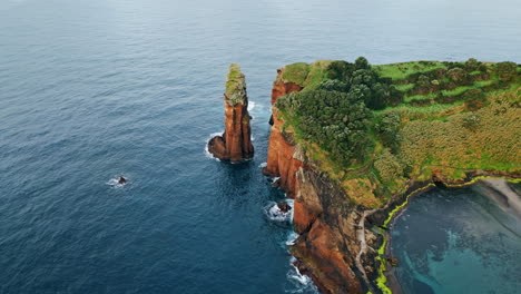 beautiful cliffs island landscape drone view. foaming waves washing rocky coast