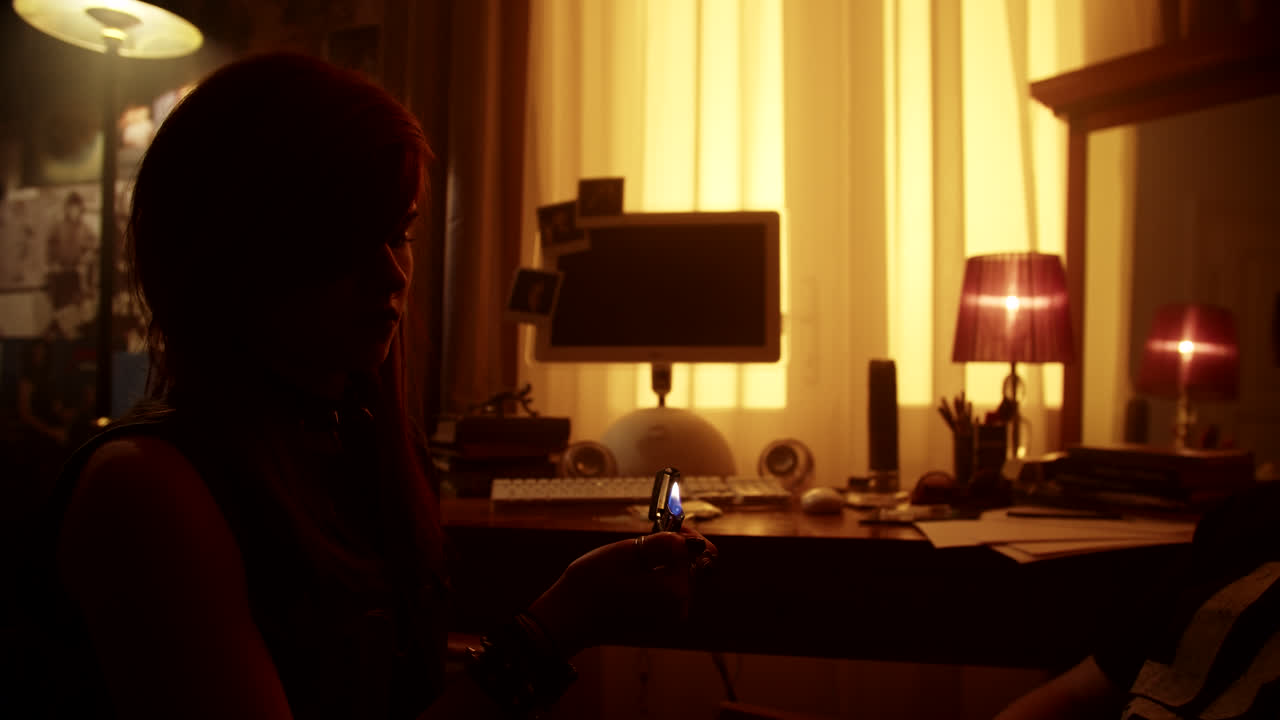Teenage Girl Holding a Lighter in a Room