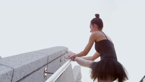 Female-ballet-dancer-stretching-on-the-stair-4k