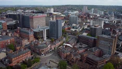 wide angle establish drone shot flying over nottingham city in england