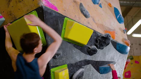 teenagers bouldering in a gym