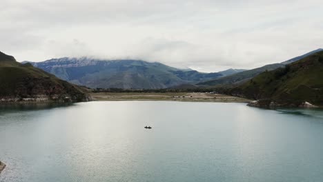 mountain lake with canoe