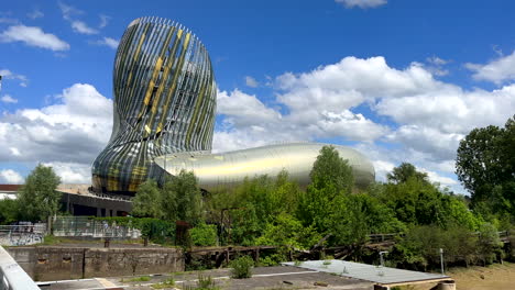 Wide-shot-of-modern-wine-museum-named-Cité-du-Vin-in-Bordeaux-during-sunny-day