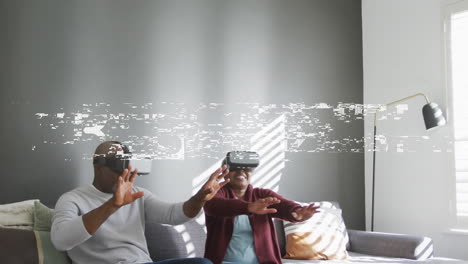 animation of vibes text over smiling senior african american couple using vr headsets