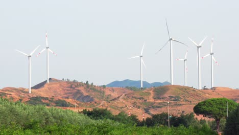 wind turbine construction in field and meadow on hill,clean energy concept, calabria , italy