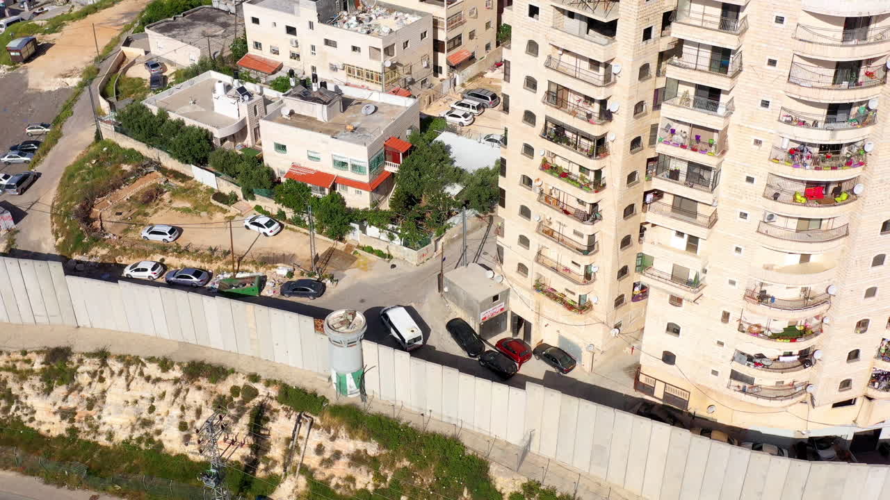 Security wall with Israeli idf watch tower Close to Shuafat Refugee Camp- Aerial