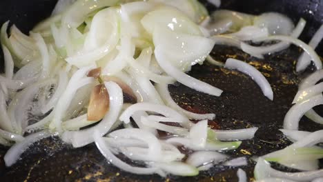 frying onions in a pan