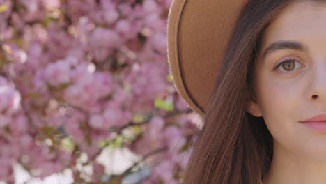 woman in a hat with cherry blossoms