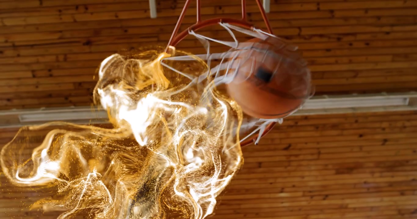 Basketballspiller under sportstrening dribler og skyter, idet siste dribling igangsetter en gyllen virvel