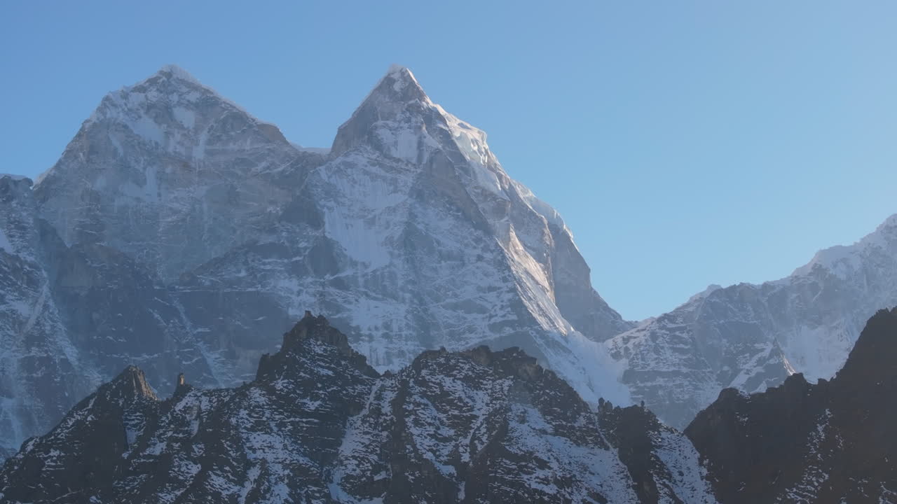 Telephoto drone shot capturing compressed views of the Himalayan mountain range in Nepal’s Everest region. Dramatic high-altitude landscape highlighting scale, depth, and alpine terrain