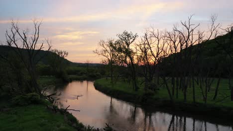 sunset over a winding river valley