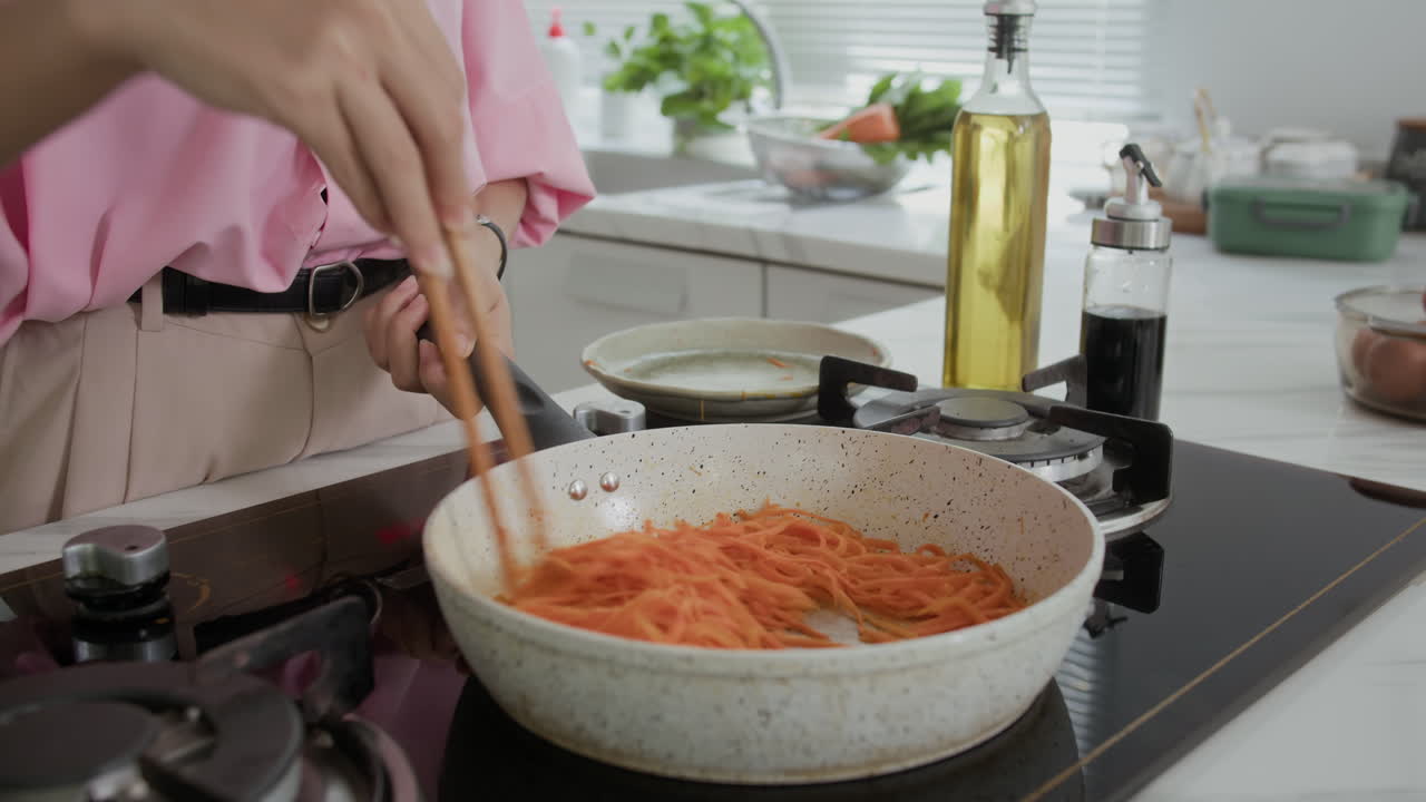 Anonymous Woman Cooking Carrot on Pan for Dish