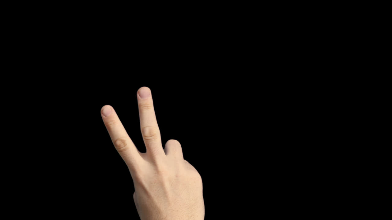 Human Hand Showing Peace Sign Gesture on Black Background