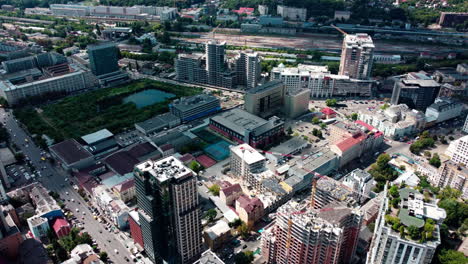 the capital of ukraine from bird's eye. flying high above kyiv city streets near city center. busy traffic aerial