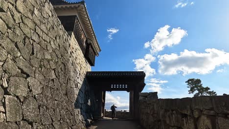 revealing shot of matsuyama castle steep stone walls , samurai castle in matsuyama, japan