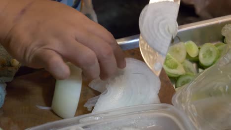 thailand night market street food booth cutting onion