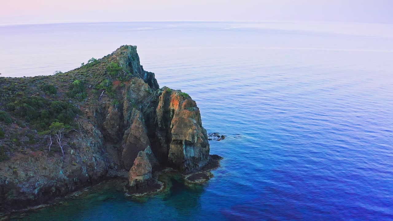 Aerial view of cliffside spit between Aegean lagoons, Mesudiye, Dat&ccedil;a, Turkey