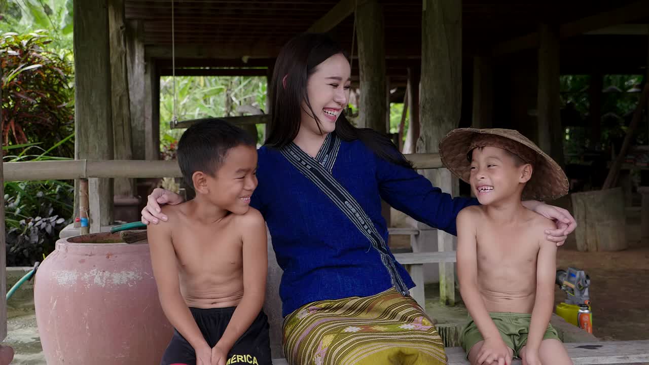 Woman and Children Laughing in a Village