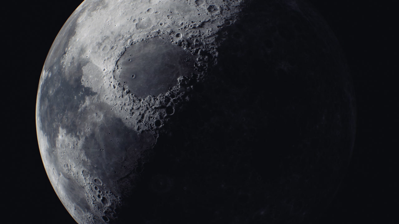 Moon in its crescent phase with detailed craters illuminated by sunlight