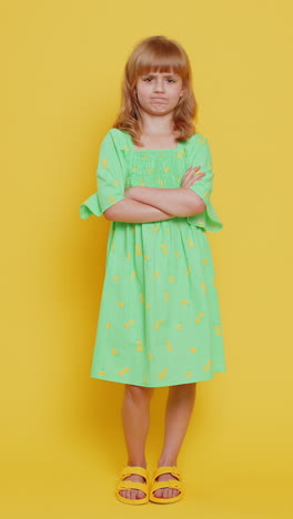 upset preteen child girl showing thumbs down dislike bad work disapproval dissatisfied feedback