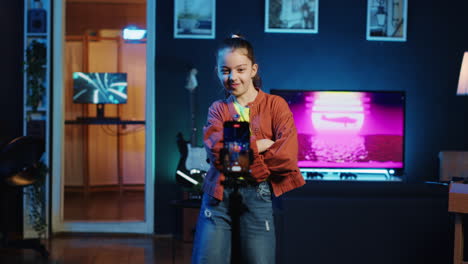 smiling child doing viral dance choreography in living room with 3d animations on monitors