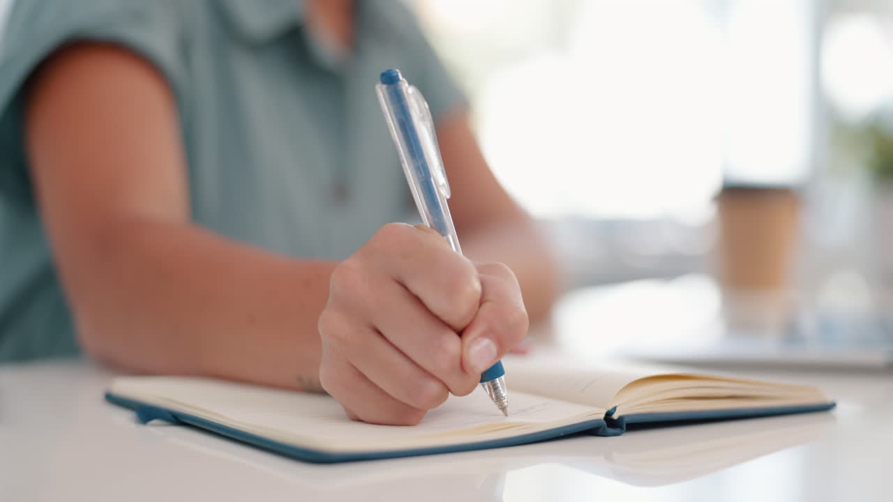 Business, woman and hands writing in notebook