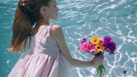 girl underwater with flowers