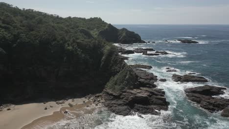 aerial approaches rocky headland and hidden sand beaches on sea coast