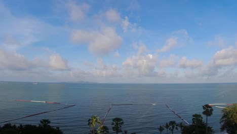 Spectacular-aerial-time-lapse-with-clouds-passing-over-the-beautiful-ocean-waters-of-the-Gulf-of-Thailand,-Pattaya,-Thailand