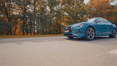 audi e tron profile view. audi e tron, a fully electric car on highway