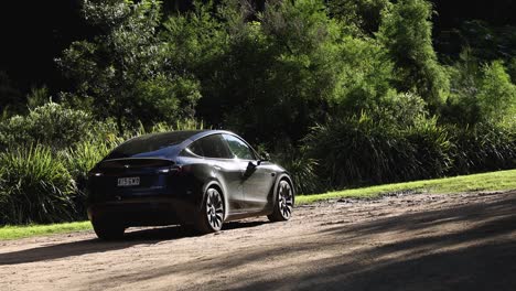 electric car driving on a forest road