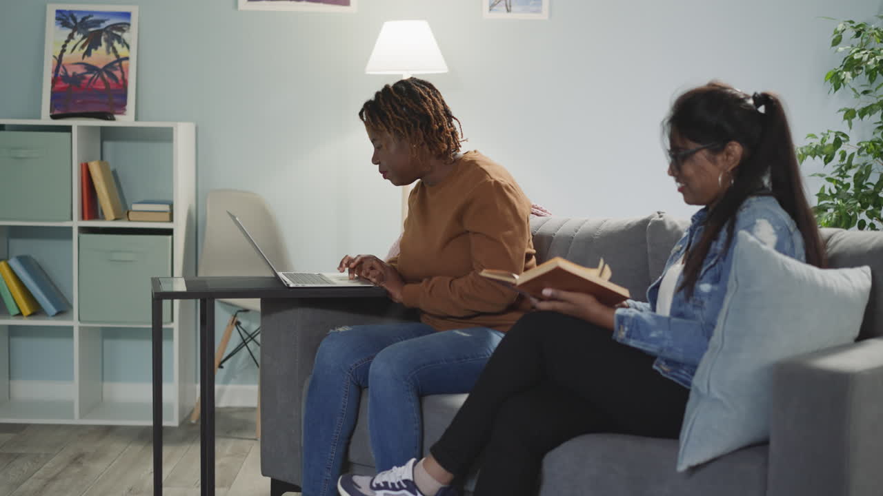 Lady students look for information using books and internet