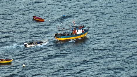 Aerial-View-Of-Motorised-Fishing-Boat-Sailing-Across-Waters-Off-Chile