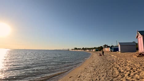 colorful beach huts and setting sun