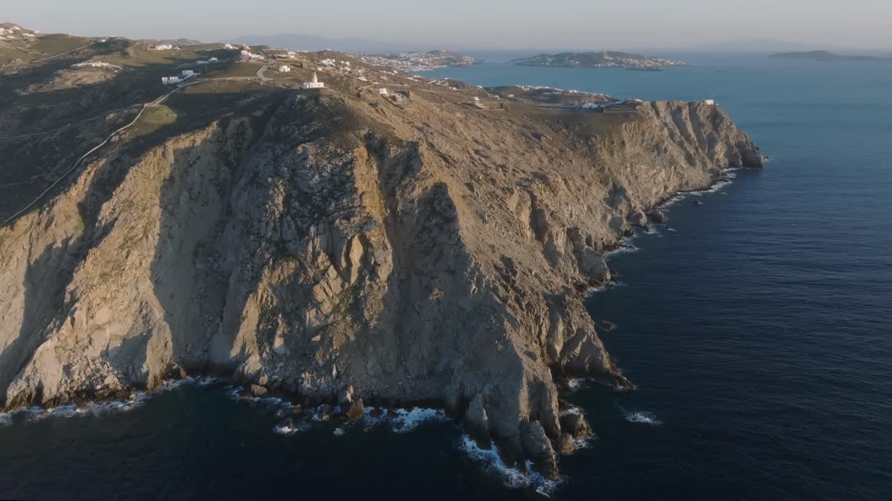 Panoramic view of Cape of Armenistis in Mykonos, featuring the historic lighthouse and stunning Aegean Sea backdrop